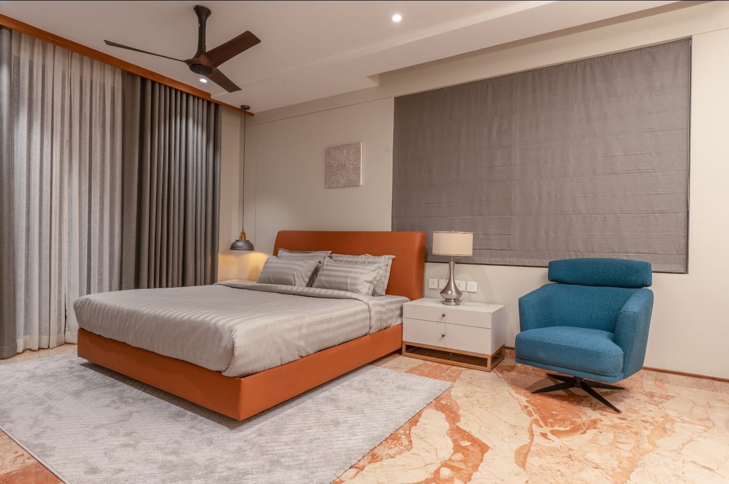 Master bedroom with terracotta headboard